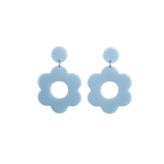 A pair of blue bold and playful statement earrings in a retro-inspired daisy flower design. The earring has a large, blue acrylic flower with a circular cutout center, hanging from a matching blue circular stud. The petals are rounded, giving off a fun, 70's style groovy vibe!!