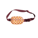 A picture of a cute, small puffy hip bag with blush pink and orange checkered print and a luxardo colored, adjustable waistband.