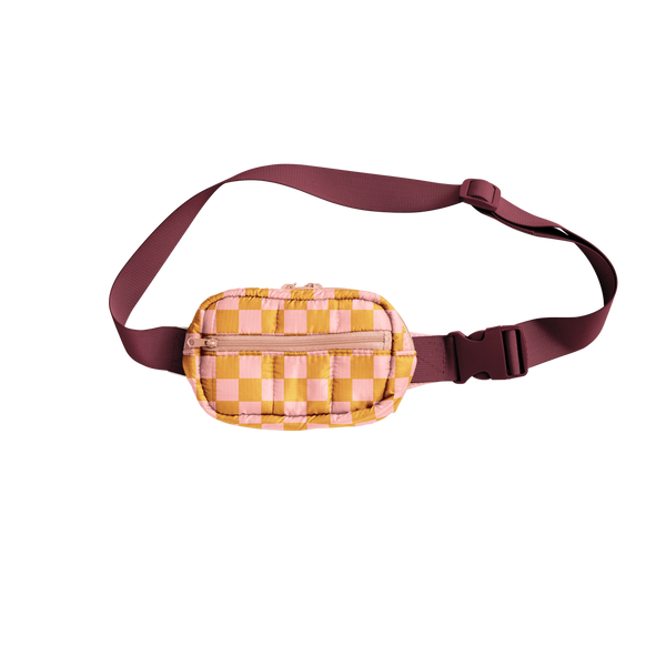 A picture of a cute, small puffy hip bag with blush pink and orange checkered print and a luxardo colored, adjustable waistband.