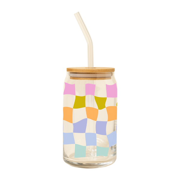 A clear can glass tumbler with lid and a clear straw featuring a retro checkerboard print in pink, green, light blue and light green colors.