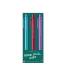 "Good Luck, Babe" jotter pens — a vibrant pack of three gel pens featuring bold phrases: “FEMININOMENON,” “VIP AT THE PINK PONY CLUB,” and “LET’S GET H-O-T T-O-G-O,” with matching ink and barrel colors in teal, red, and purple.