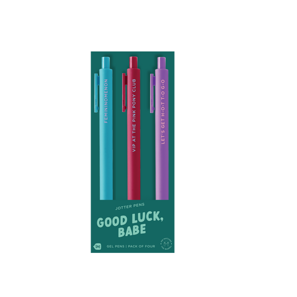 "Good Luck, Babe" jotter pens — a vibrant pack of three gel pens featuring bold phrases: “FEMININOMENON,” “VIP AT THE PINK PONY CLUB,” and “LET’S GET H-O-T T-O-G-O,” with matching ink and barrel colors in teal, red, and purple.