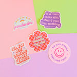 Taylor Swift inspired stickers laying on colored paper
