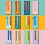 Colorful collection of 12 Toot Jotters gel pen sets, each pack of three featuring playful and expressive quotes like “DON’T BE A DICK,” “JUST BREATHE,” “SCHOOLIN’,” “WORK MOOD,” and more — vibrant jotter pens designed for personality-packed writing with matching ink and barrel colors.