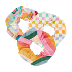 A set of 3 super cute scrunchies made out of life proof/rip proof materials in funky trippy patterns in an array of colors ranging from orange to lime green, purple, and blues, checker board pattern and colorful waves.