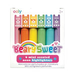A box holding 6 mini scented neon highlighters. These scented highlighters are the following colors and their scents--pink=strawberry, orange=orange, yellow=banana, green=melon, blue=blueberry, purple=grape. Each highlighter has a bear shaped lid.