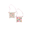 small banner with the phrase merry and bright in mulit-color type font with hearts between the words and a small flag with phrase festive festive festive in multi-color letters with pink background. 