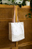 All That Grocery tote with leather handles. Chill hills pattern in metallic gold on all sides of the bag. 