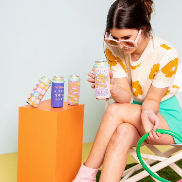 Enjoying some sun with reversible can cooler in pink and a good vibrations sunset design. 