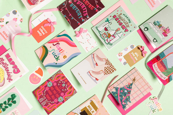Layout of various holiday cards and gift tags
