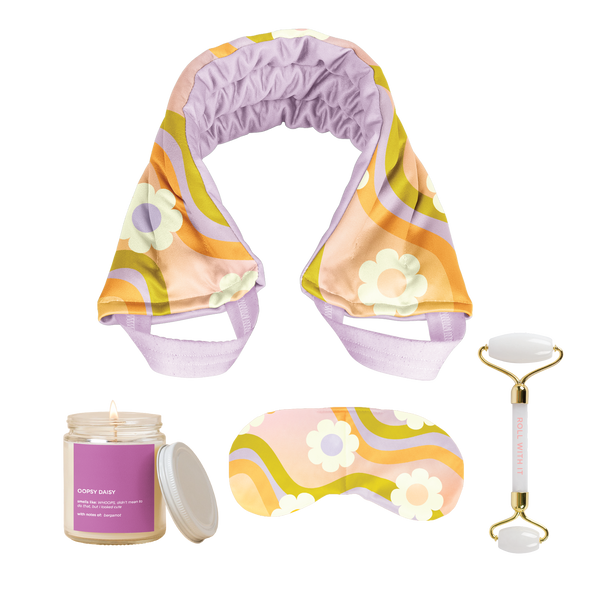 Colorful rainbow wave with flowers around weighted neck wrap and eye pillow with an "oopsie daisy" purple candle and a face roller. 