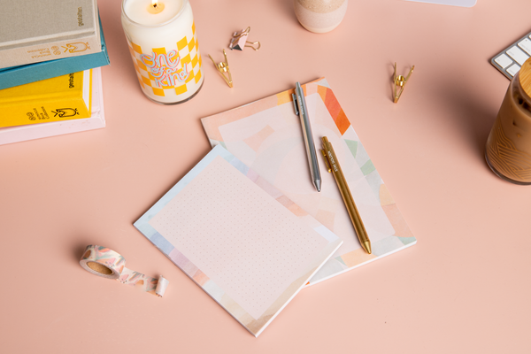 1 medium and 1 small tearaway notepad; 2 TOOT pens; 1 washi tape; "one of a kind" candle