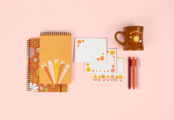 cute notebooks, a floral stationery set with pens and a mug