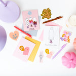 Halloween greeting cards in 3 variations; Halloween greeting card with pink ghost and word bubble saying "you my boo"; Greeting card with 3 ghosts in various designs under a disco ball saying "ghouls just want to have fun"; Greeting card with ghost in roller skates saying "happy halloween, witches"