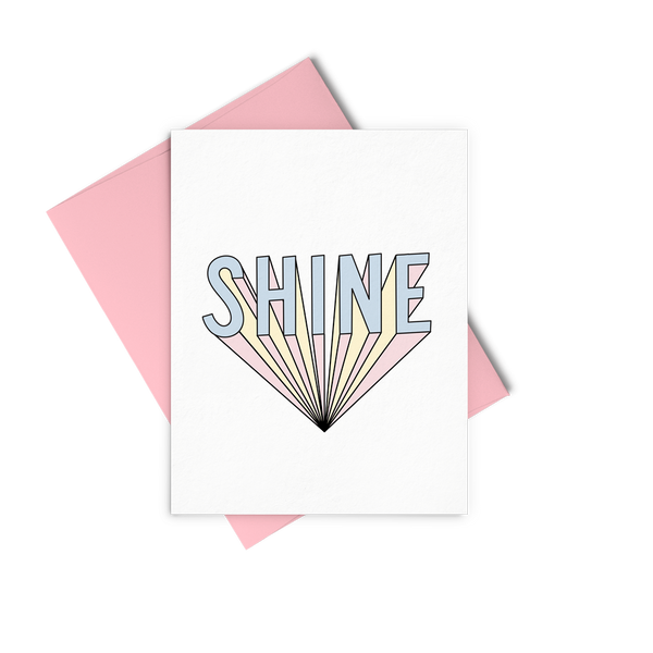 Shine greeting card is a bold graphic lettering and a pink envelope.