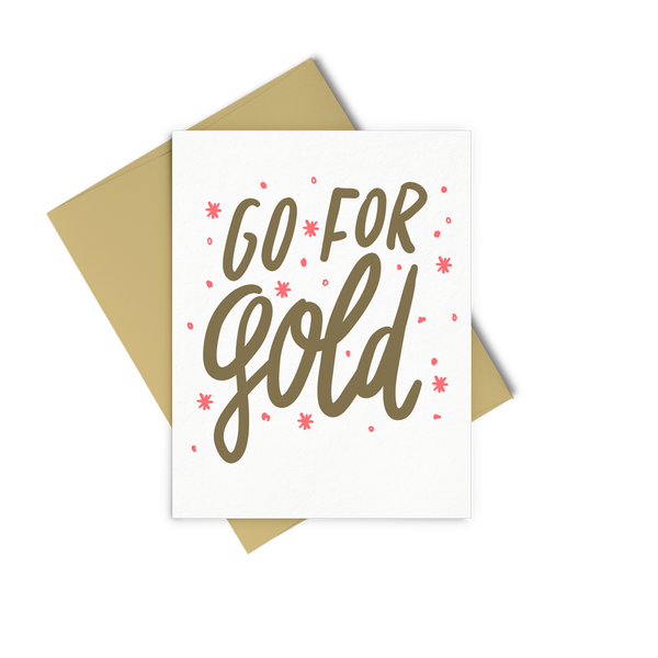 Go For Gold encouraging greeting card with gold and coral design and a gold envelope.