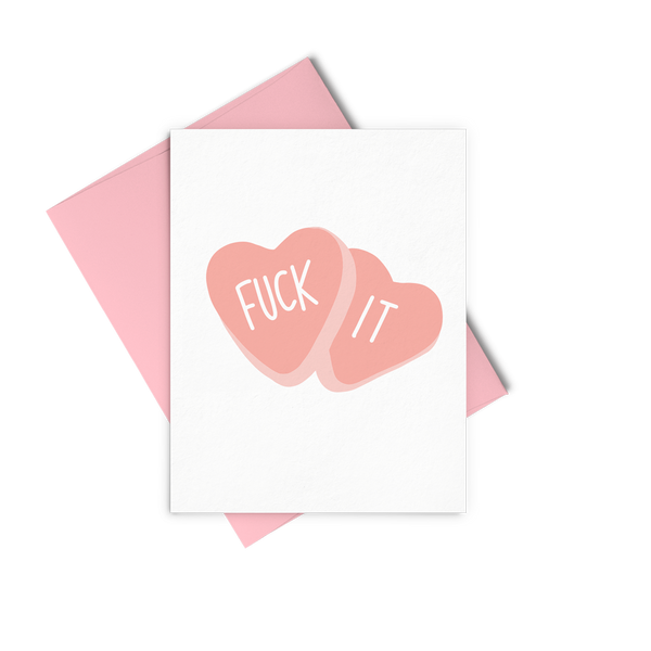 Fuck It is a greeting card of two red candy hearts and a pink envelope. 