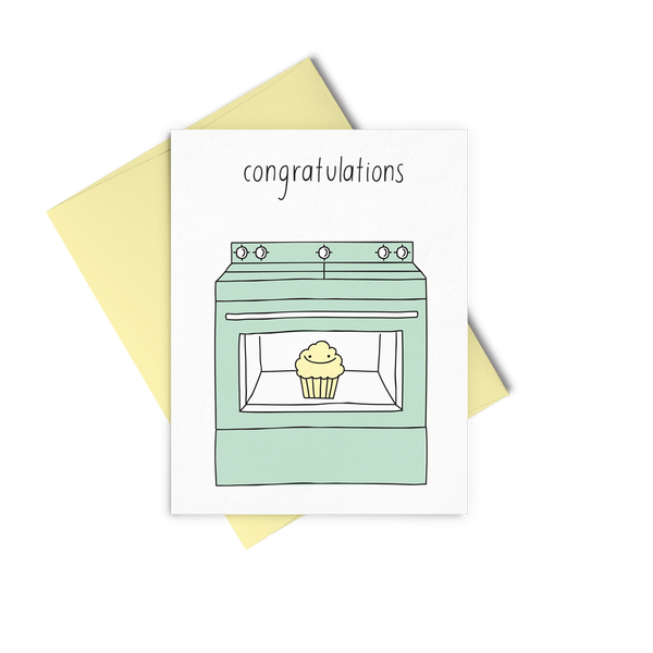 Baby cards that reads Congratulations and showing a mint green oven that has a little yellow muffin inside. 