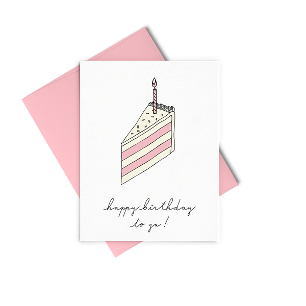 Letterpress greeting card showing a single slice of pink and cream layered birthday cake with a single candle and Happy Birthday To You written under the slice. 