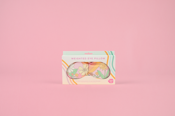 weighted eye mask with floral and swirl print in pink, yellow and orange