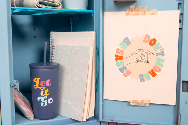 Dark blue "Let It Go" cold cup/tumbler in blue school locker.