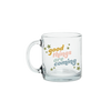 A clear glass mug with the phrase 