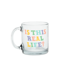 a cute glass mug that says is this real life in blue yellow and peach
