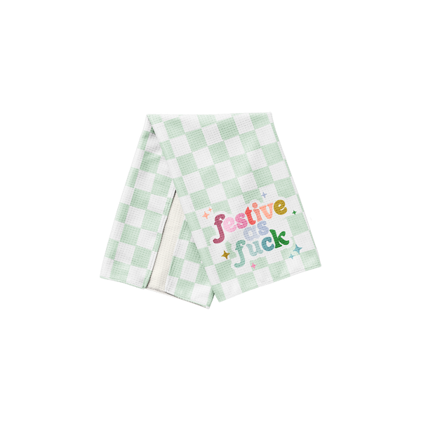 Festive As Fuck Tea Towel
Tis the damn season, and this towel is here to shout it loud. Featuring bold, rainbow typography over a fresh green gingham backdrop, this cheeky tea towel makes spirits bright (and kitchens sassier). Whether you're baking cookies or hosting a wild ugly sweater party, this towel brings unapologetic holiday flair to your space.