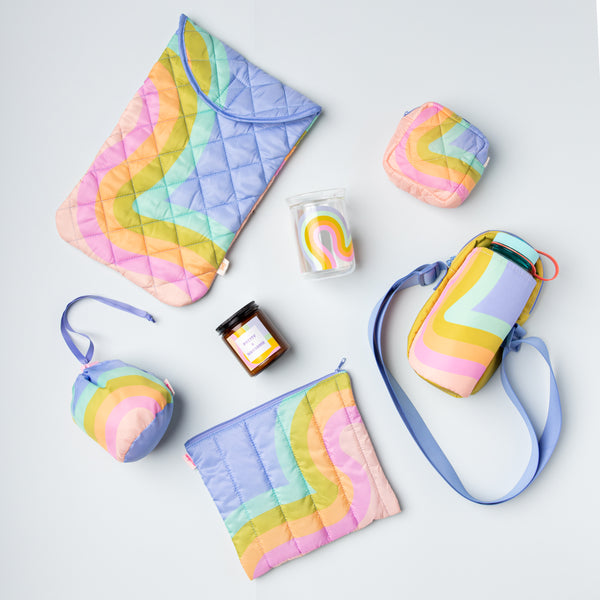 Elizabeth Olwen's collaboration cellection in the waves pattern with Talking Out of Turn on a baby blue background.