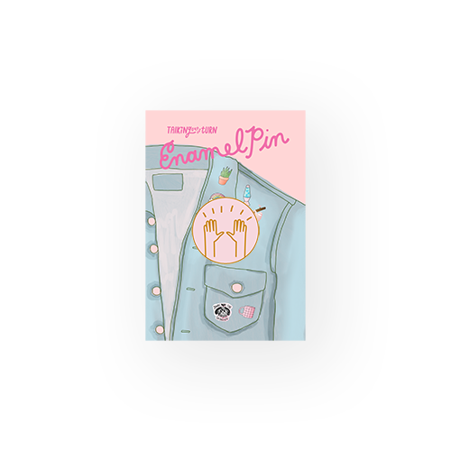 a pin circle enamel pin with raised hands